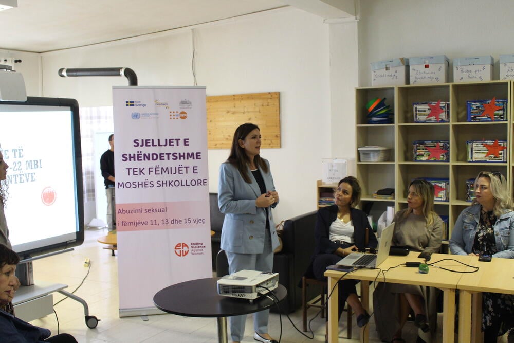 Gentiana Qirjako, Public Health expert explaining the findings from HBSC surveillance to training participants in a room