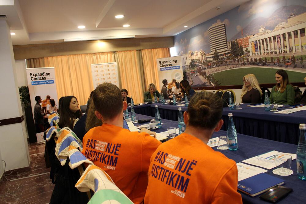 Representatives from UNFPA and the private sector sitting at the discussion table