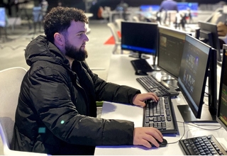 Renato seated in his work position at EuroNews TV channel