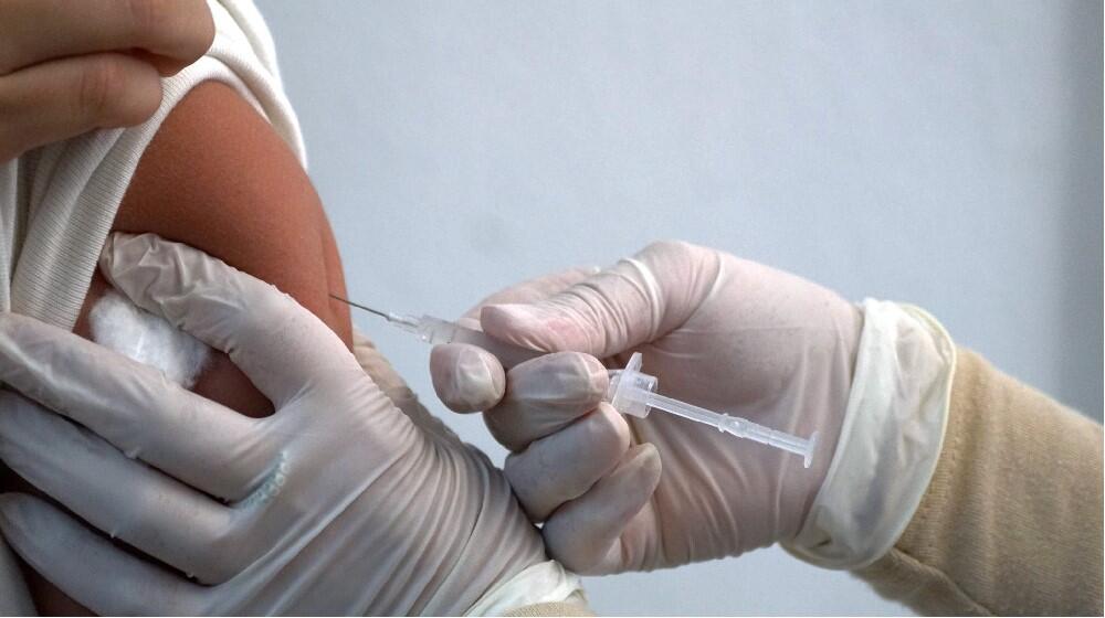 A girl gets vaccinated in Public Health Care Center against Papiloma Virus